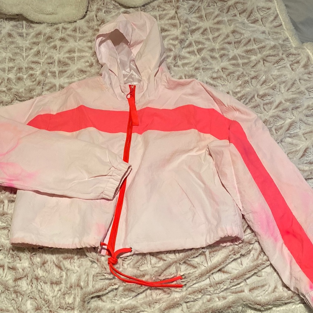 light tye-dye jacket with hood, pockets, and draw string. good material for rain